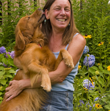Jane Booth and best friend, Roxy, in a New England garden